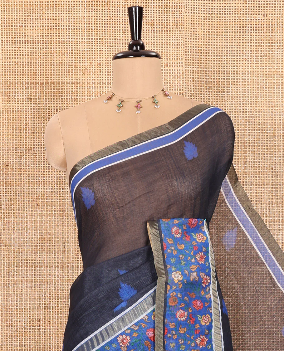 Black Linen Saree Adorned with Leaf Motifs All Over Its Body, Complemented by a Contrast Floral Vine Printed Border, Pallu Mirrors the Floral Vine Print, and Paired with a Contrast Floral Printed Blouse - Image 2