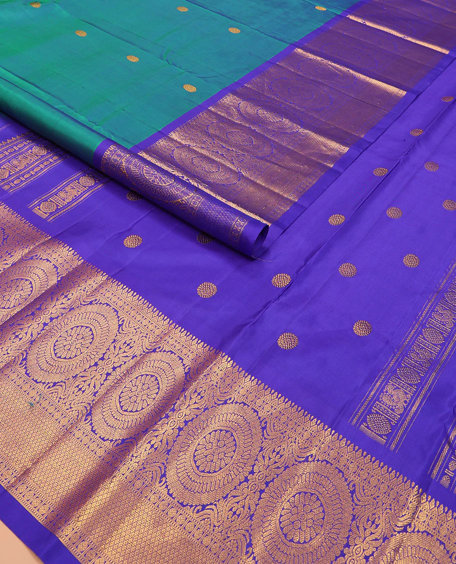 Blue chakram buttas Kanchipuram silk saree, contrast border of muthu, rudraksham,  poo chakram, and mayil kann designs, and chakram motifs pallu - Image 2