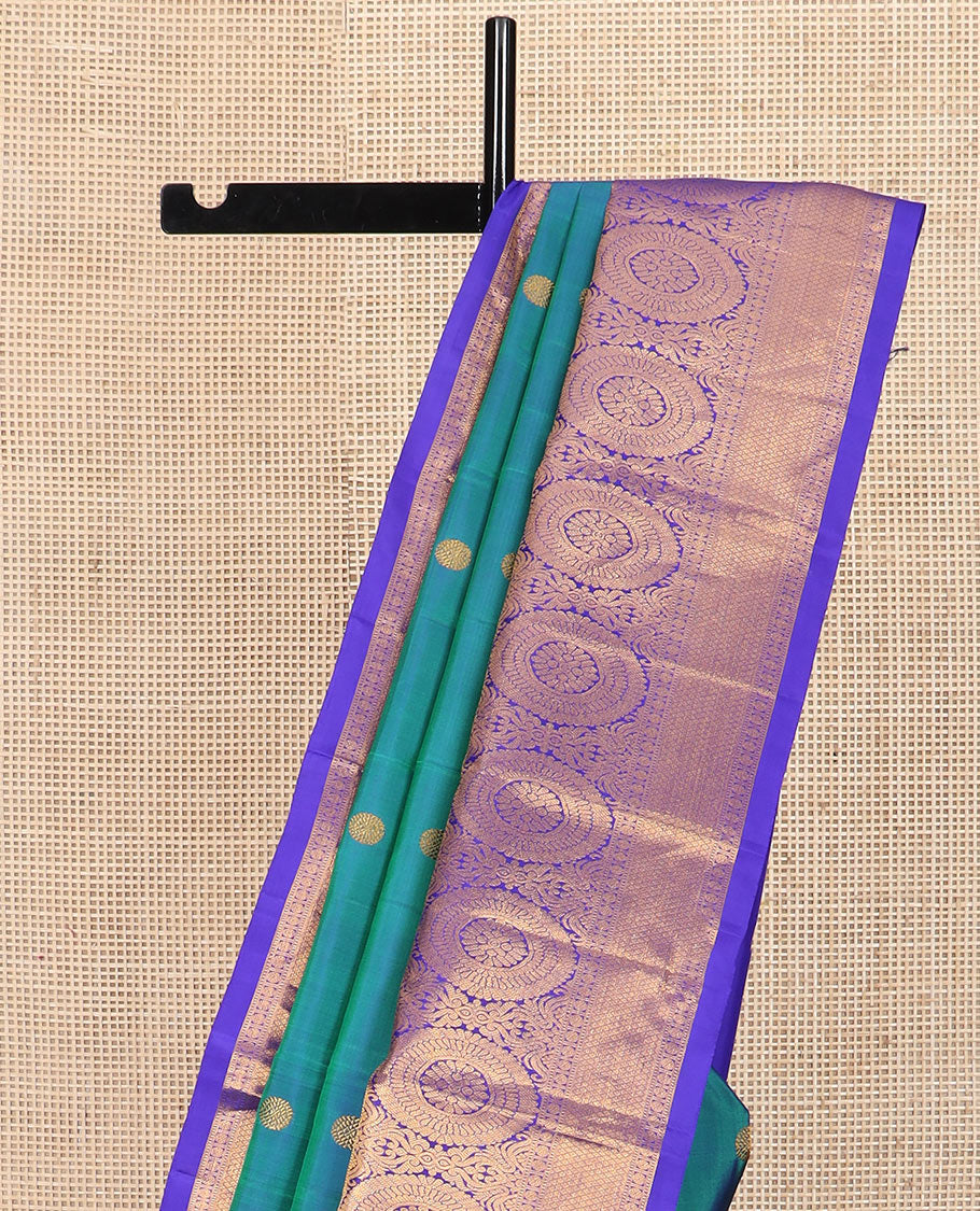 Blue chakram buttas Kanchipuram silk saree, contrast border of muthu, rudraksham,  poo chakram, and mayil kann designs, and chakram motifs pallu - Image 3