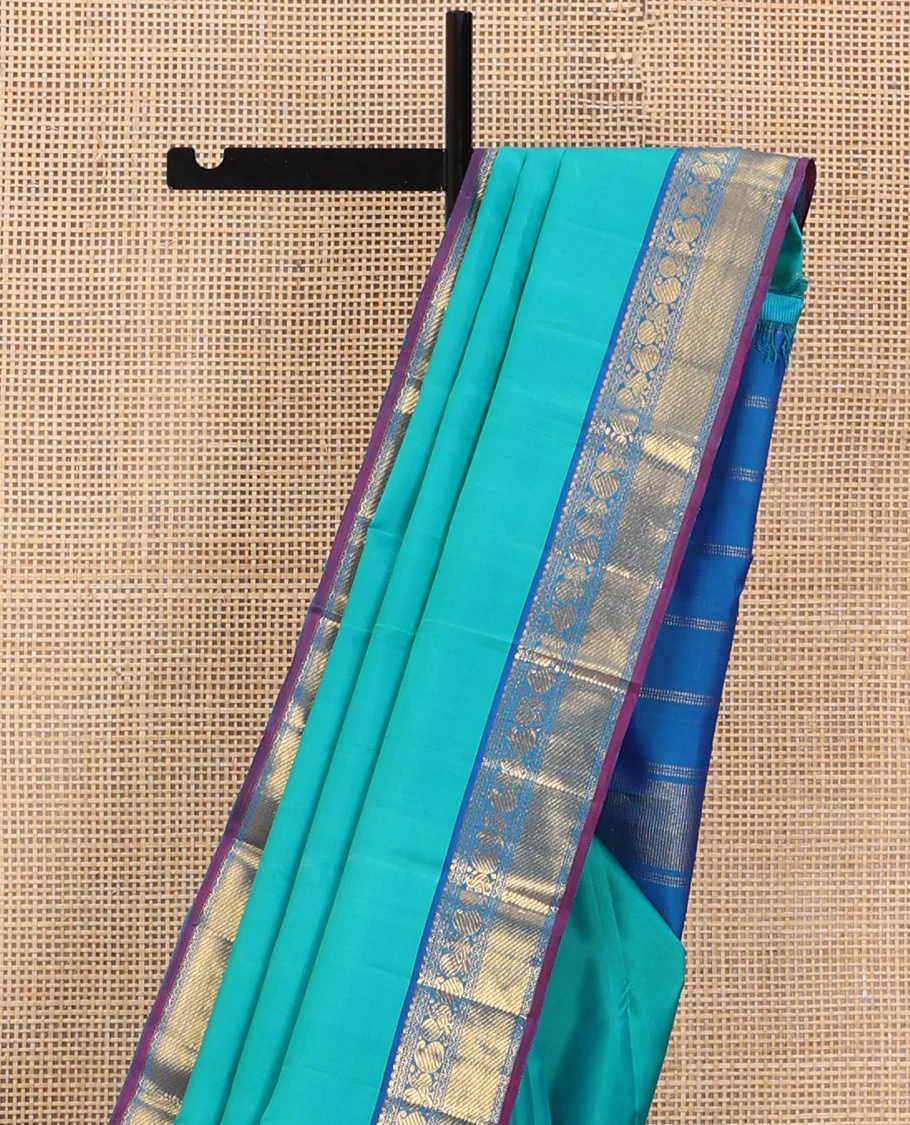 Blue Plain Kanchipuram Silk Saree, Complemented by Contrast Border of Salngai, Muthu, Rekku, Manga, Mayil, and Zari Stripes, Subtly Sparkled Pallu, and Paired with a Contrast Blouse - Image 3