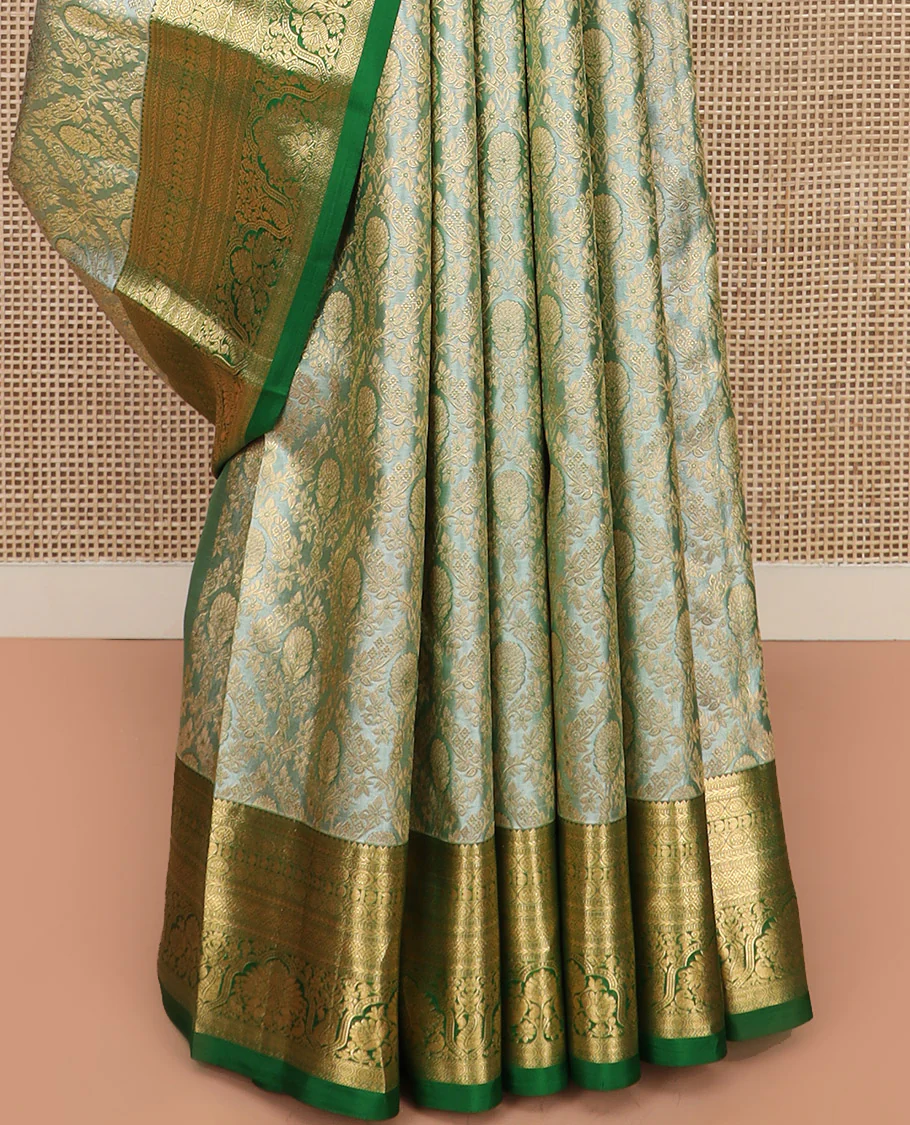 Green Kanchipuram Silk Saree Embellished with Jacquard Design, Highlighted by a Contrast Border of Thilakam, Muthu, Rekku, Manga, Chakram, and Floral Designs, Majestically Woven Pallu Steeped with Chakram Designs, and Paired with a Matching Blouse - Image 4