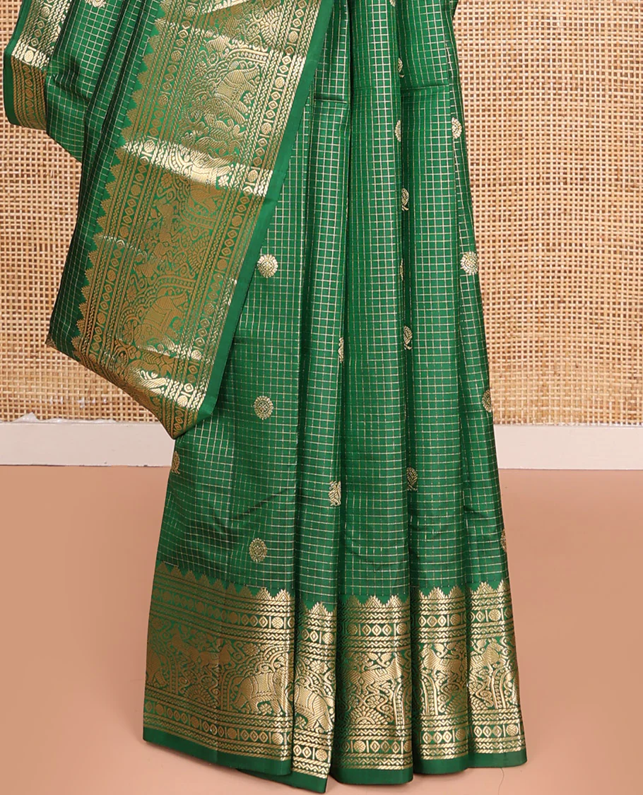 Green Vasundhara Silk Saree Gleamed Up with Zari Checks and Annam Chakram Buttas, Complemented by a Zari Border of Thazampoo Rekku, Neli, Rudraksham, Diamond and Yaanai Designs, Zari Embellished Pallu of Jaal Designs, and Paired with a Matching Blouse - Image 4