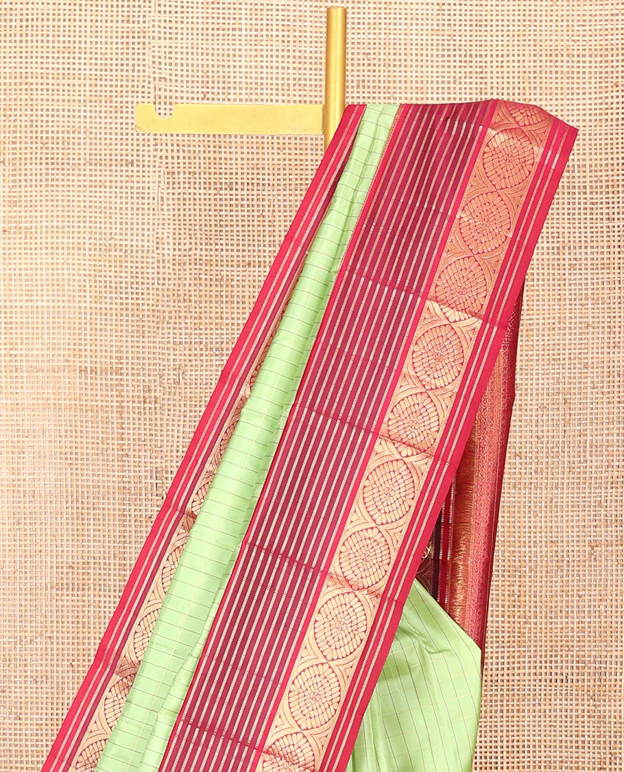 Green Vasundhara Silk Saree Subtly Sparkled with Stripes, Highlighted by a Contrast Border of Muthu, Diamond, Kamalam, and Laddu Kamalam Designs, Delicately Woven Pallu of Intricate Designs, and Paired with a Contrast Blouse - Image 3