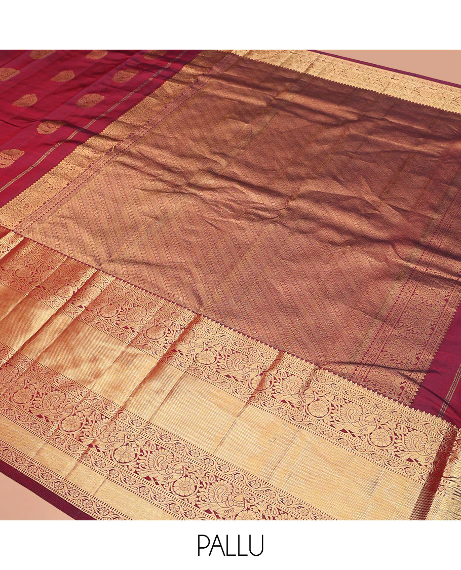 Maroon Vasundhara Silk Saree Ornamented with Zari Buttas All Over Its Body, Highlighted by Zari Border of Rekku, Kodi Visiry, Mayil, and Kuyil Kann Designs, a Grand Pallu of Diagonal Stripes, and Paired with a Matching Blouse - Image 5
