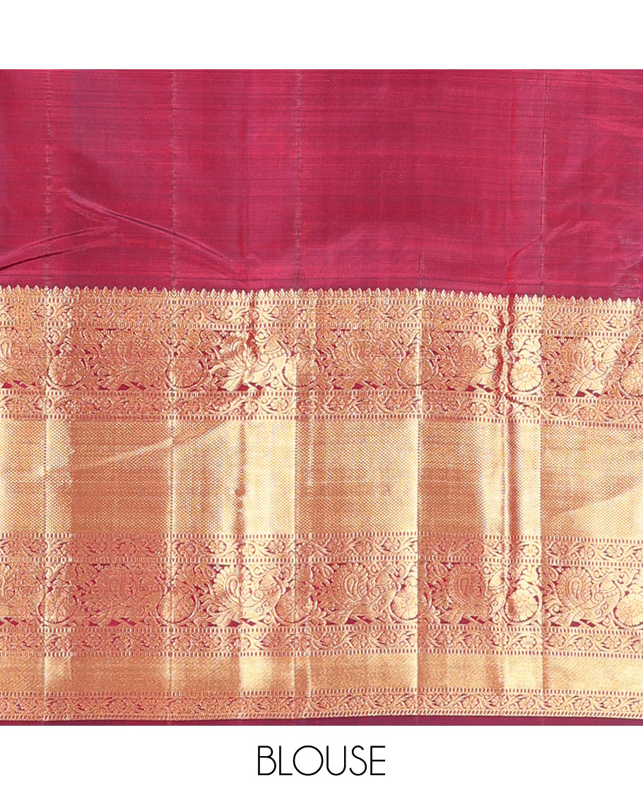 Maroon Vasundhara Silk Saree Ornamented with Zari Buttas All Over Its Body, Highlighted by Zari Border of Rekku, Kodi Visiry, Mayil, and Kuyil Kann Designs, a Grand Pallu of Diagonal Stripes, and Paired with a Matching Blouse - Image 6