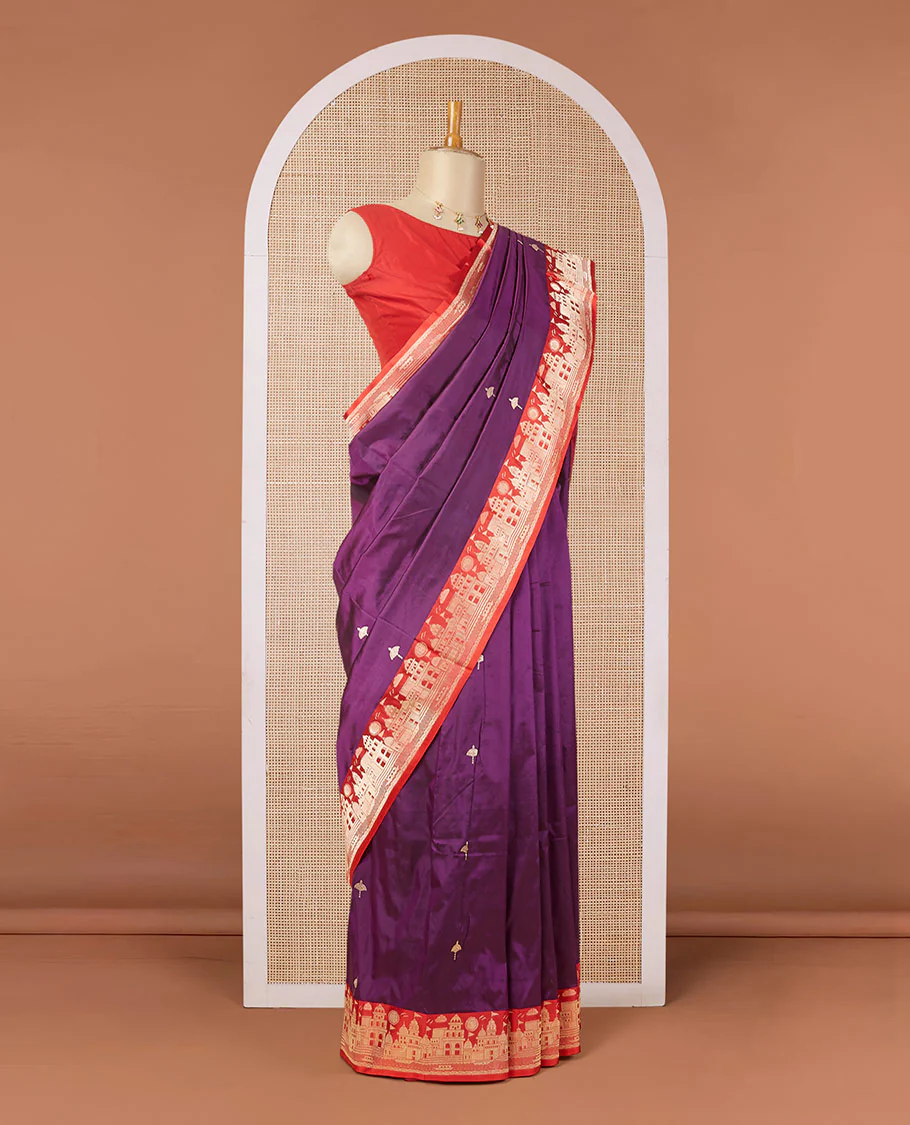 Purple katan silk saree with zari buttas, contrast border & zari-rich pallu adorned with Mughal-theme buildings